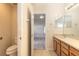 Main bathroom with toilet, sink, and access to bedroom at 3198 Bower Ln, Deltona, FL 32725