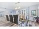 Bright dining area featuring a glass-top table and six chairs at 3333 S Atlantic Ave # 1803, Daytona Beach Shores, FL 32118