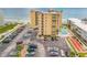 Aerial view showing building, parking, and ocean at 3501 S Atlantic Ave # 407, New Smyrna Beach, FL 32169