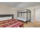 Guest bedroom with a full-size bed and a twin-over-full bunk bed at 3501 S Atlantic Ave # 407, New Smyrna Beach, FL 32169