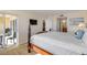Comfortable bedroom with king-size bed and private balcony access at 3501 S Atlantic Ave # 407, New Smyrna Beach, FL 32169