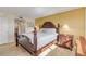 Bright bedroom with king-size bed and access to balcony at 3501 S Atlantic Ave # 407, New Smyrna Beach, FL 32169
