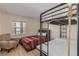 Bedroom with bunk beds and a comfortable sitting area at 3501 S Atlantic Ave # 407, New Smyrna Beach, FL 32169