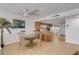 Kitchen with granite countertops and breakfast bar with stools at 3501 S Atlantic Ave # 407, New Smyrna Beach, FL 32169