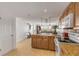 Well-equipped kitchen featuring granite countertops and wood cabinets at 3501 S Atlantic Ave # 407, New Smyrna Beach, FL 32169
