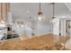 Kitchen features granite countertops and an island with pendant lighting at 3501 S Atlantic Ave # 407, New Smyrna Beach, FL 32169
