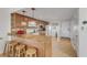 Well-equipped kitchen with granite countertops and breakfast bar at 3501 S Atlantic Ave # 407, New Smyrna Beach, FL 32169