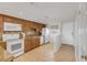Bright kitchen with granite countertops and stainless steel appliances at 3501 S Atlantic Ave # 407, New Smyrna Beach, FL 32169
