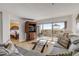 Living room with sectional sofa, bedroom view, and balcony access at 3501 S Atlantic Ave # 407, New Smyrna Beach, FL 32169