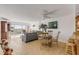 Open concept living and dining area with kitchen and bedroom access at 3501 S Atlantic Ave # 407, New Smyrna Beach, FL 32169