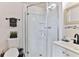 Clean bathroom with a glass shower and white vanity at 3509 S Atlantic Ave # 108 & 109, New Smyrna Beach, FL 32169