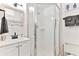 Small bathroom with shower, sink, and toilet at 3509 S Atlantic Ave # 108 & 109, New Smyrna Beach, FL 32169
