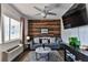 Living room with wood accent wall and comfy seating at 3509 S Atlantic Ave # 108 & 109, New Smyrna Beach, FL 32169