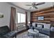 Living area with wood wall and window view at 3509 S Atlantic Ave # 108 & 109, New Smyrna Beach, FL 32169