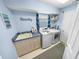 Laundry room with washer, dryer, and sink at 37 Loggerhead Ct, Ponce Inlet, FL 32127