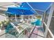 Relaxing pool area with covered patio and seating at 37 Loggerhead Ct, Ponce Inlet, FL 32127