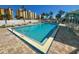 Inviting community pool with lounge chairs and shaded areas at 3800 S Atlantic Ave # 608, Daytona Beach Shores, FL 32118