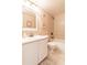 Bathroom with white vanity, tub, and tiled walls at 3801 S Atlantic Ave # Ut104, New Smyrna Beach, FL 32169