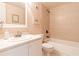 Bathroom with white vanity, tub, and tiled walls at 3801 S Atlantic Ave # Ut104, New Smyrna Beach, FL 32169