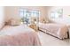 Bedroom with two twin beds and floral bedspreads at 3801 S Atlantic Ave # Ut104, New Smyrna Beach, FL 32169
