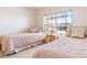 Bedroom with two twin beds and floral bedspreads at 3801 S Atlantic Ave # Ut104, New Smyrna Beach, FL 32169