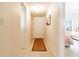 Neutral hallway with tiled floors and a door leading to a bedroom at 3801 S Atlantic Ave # Ut104, New Smyrna Beach, FL 32169