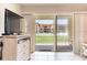 View from living room sliding doors showcases the resort-style pool at 3801 S Atlantic Ave # Ut104, New Smyrna Beach, FL 32169