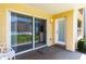 View of patio with sliding glass doors leading to a pool at 3801 S Atlantic Ave # Ut104, New Smyrna Beach, FL 32169