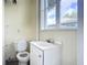 Small bathroom with white vanity and toilet at 409 N Ridgewood Ave, Edgewater, FL 32132