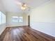 Bright living room with hardwood floors and ceiling fan at 409 N Ridgewood Ave, Edgewater, FL 32132