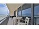Private balcony with ocean view and outdoor seating at 4139 Atlantic # A406, New Smyrna Beach, FL 32169