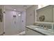Updated bathroom with a walk-in shower, granite countertop, and white subway tile at 4139 Atlantic # A406, New Smyrna Beach, FL 32169