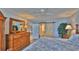King size bed, dresser and ensuite bathroom at 4139 Atlantic # A406, New Smyrna Beach, FL 32169