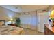 Bedroom with full-size bed, ceiling fan, and wood dresser at 4139 Atlantic # A406, New Smyrna Beach, FL 32169