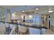 Modern kitchen with white cabinets and granite countertops at 4139 Atlantic # A406, New Smyrna Beach, FL 32169