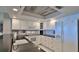 Well-equipped kitchen with granite countertops and white cabinets at 4139 Atlantic # A406, New Smyrna Beach, FL 32169