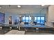 Kitchen features granite counters, white cabinets, and ocean view at 4139 Atlantic # A406, New Smyrna Beach, FL 32169