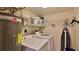 Laundry room with washer, dryer, and ample shelving at 4139 Atlantic # A406, New Smyrna Beach, FL 32169
