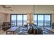 Living room boasts ocean views and leather furniture at 4139 Atlantic # A406, New Smyrna Beach, FL 32169
