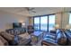 Relaxing living room with ocean view and comfortable seating at 4139 Atlantic # A406, New Smyrna Beach, FL 32169