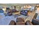 Spacious living room with leather furniture and ocean view at 4139 Atlantic # A406, New Smyrna Beach, FL 32169