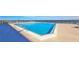 Ocean view rooftop pool with lounge chairs at 4139 Atlantic # A406, New Smyrna Beach, FL 32169