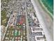 Aerial view highlighting property's proximity to beach and local attractions at 4150 S Atlantic Ave # 103A, New Smyrna Beach, FL 32169