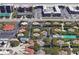 Aerial view showing property's location within a complex near tennis courts and pool at 4150 S Atlantic Ave # 103A, New Smyrna Beach, FL 32169