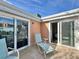 Private balcony with lounge chair and outdoor seating at 4150 S Atlantic Ave # 103A, New Smyrna Beach, FL 32169