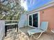 Balcony with seating, glass top table and views at 4150 S Atlantic Ave # 103A, New Smyrna Beach, FL 32169
