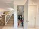 Under-stair storage area with shelving and various items at 4150 S Atlantic Ave # 103A, New Smyrna Beach, FL 32169