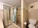 Clean bathroom with shower stall, toilet and vanity at 4150 S Atlantic Ave # 103A, New Smyrna Beach, FL 32169