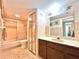 Bathroom with tub, toilet and double vanity at 4150 S Atlantic Ave # 103A, New Smyrna Beach, FL 32169