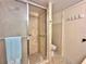 Bathroom with shower stall and toilet at 4150 S Atlantic Ave # 103A, New Smyrna Beach, FL 32169